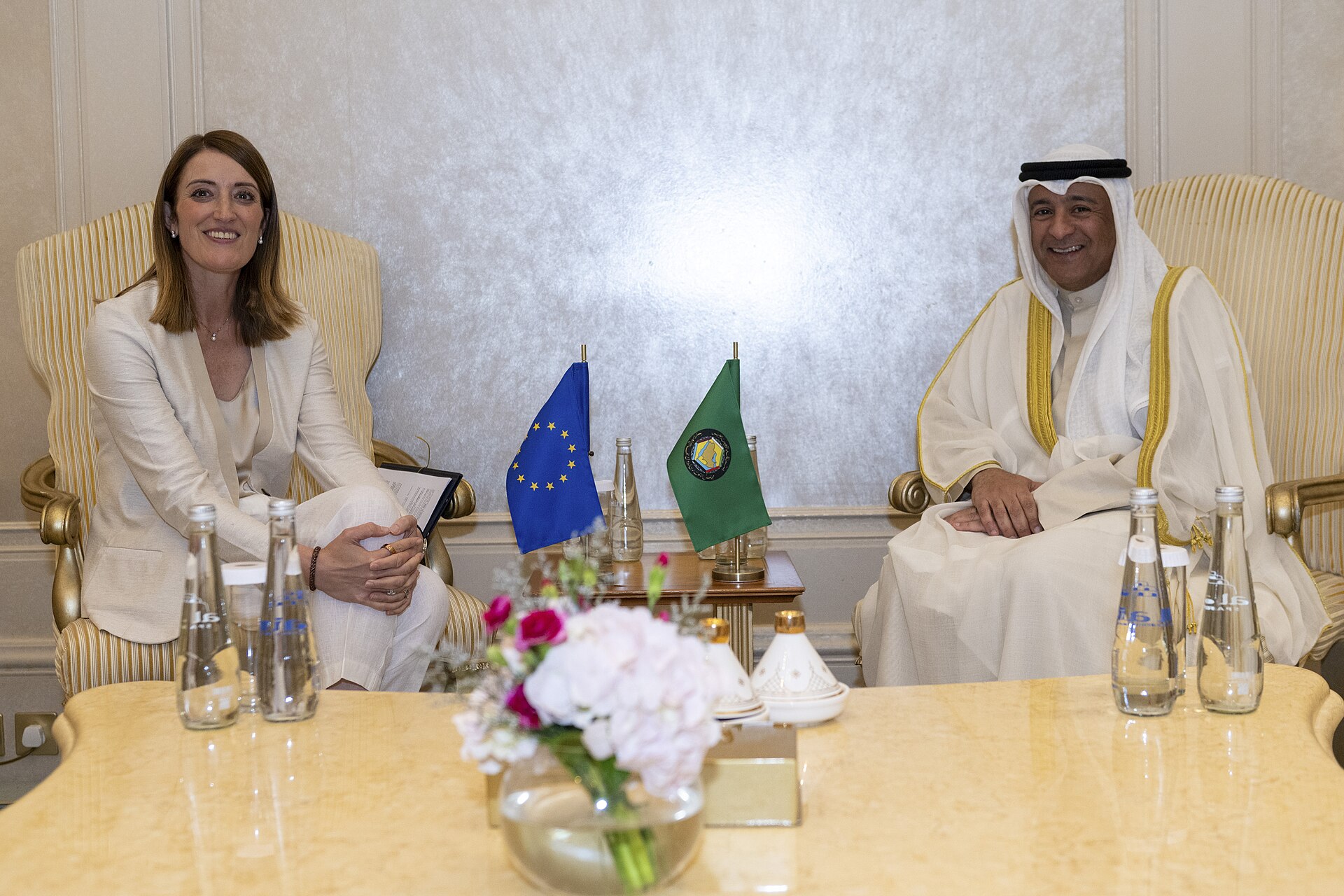 Roberta Metsola, European Parliament President, meets GCC Secretary-General Jasem Al-Budaiwi in Abu Dhabi, 2025, with EU and GCC flags on the table