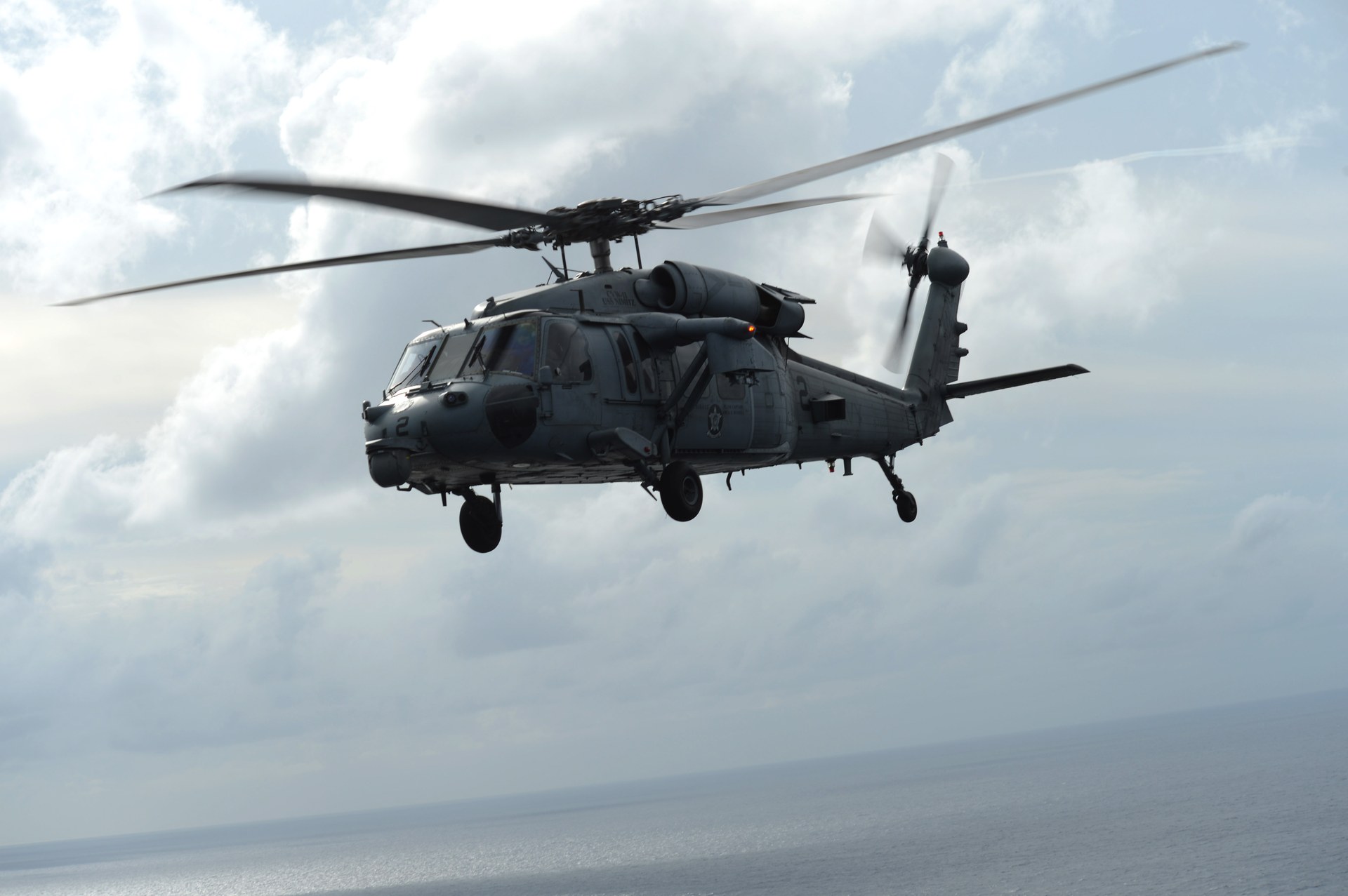 A US Navy MH-60S Seahawk helicopter from Helicopter Sea Combat Squadron 6 conducts mine countermeasure operations over the Indian Ocean