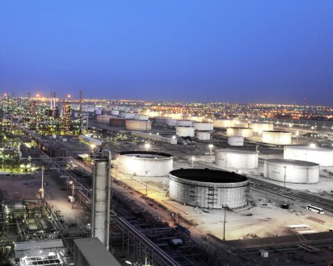 Mina al-Ahmadi oil refinery Kuwait at night, showing storage tanks and processing units at the KNPC facility 40 kilometres south of Kuwait City