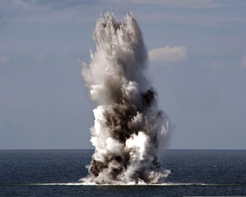 A naval mine detonates in the Baltic Sea during a minesweeping exercise as part of BALTOPS 2013, sending a column of water and smoke into the air