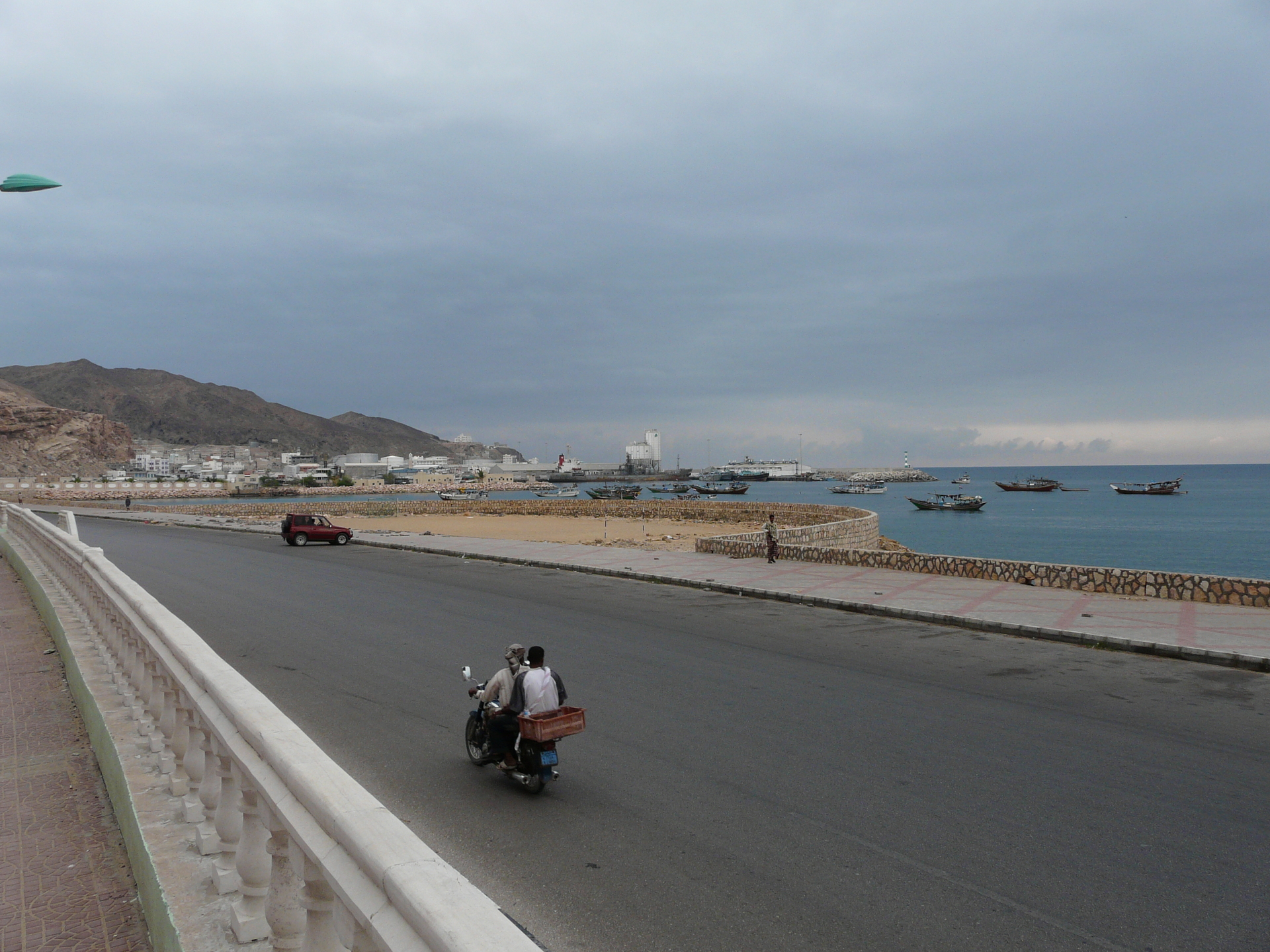 Mukalla port in Hadramawt province, Yemen, showing coastal harbor and fishing vessels along the Arabian Sea