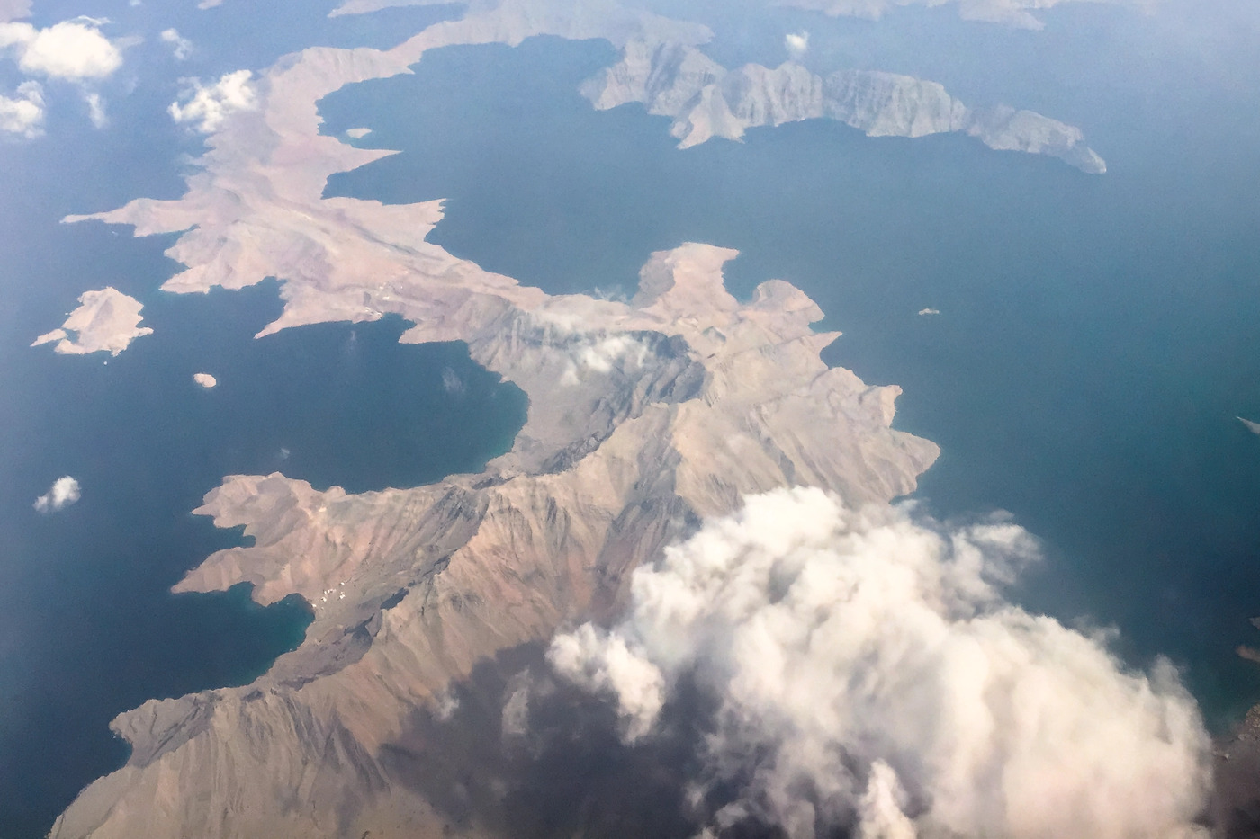 Aerial view of the Musandam Peninsula fjord inlets along the Oman coastline overlooking the Strait of Hormuz