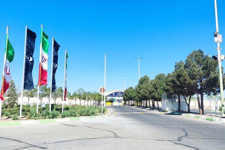 The entrance road of the Natanz nuclear enrichment complex in Iran, flying Iranian flags, photographed in 2022