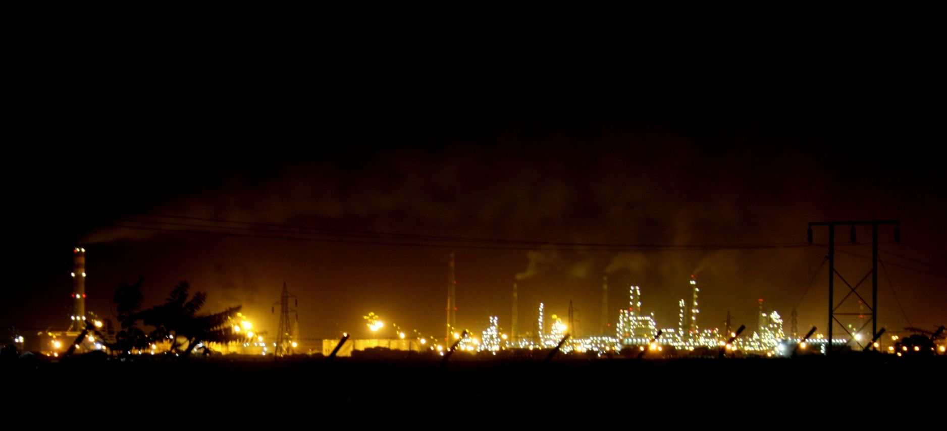 Nayara Energy Vadinar refinery at night — formerly the Essar Oil refinery on the Gujarat coast, now majority-owned by Rosneft PJSC