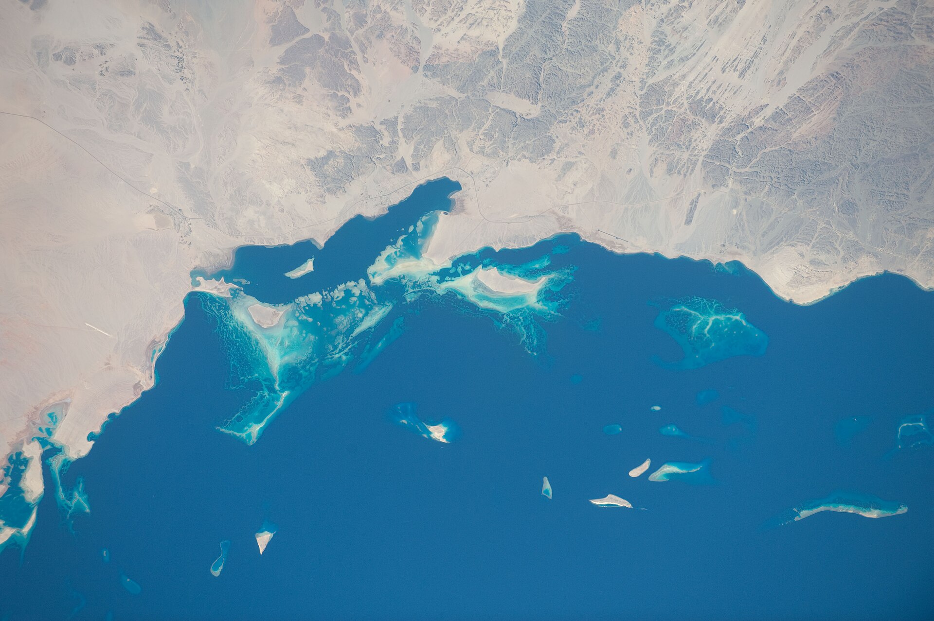 NEOM Sharma coastline and Red Sea islands viewed from the International Space Station — the planned site of Oxagon industrial port on northwest Saudi Arabia’s Red Sea coast