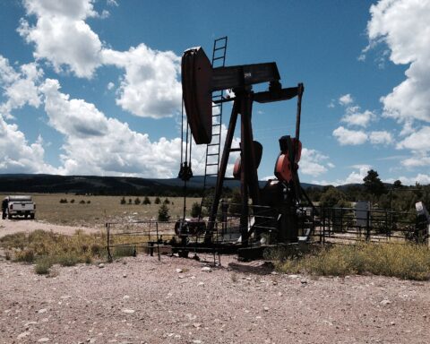 Oil pump jack operating in a remote field, representing OPEC crude oil production capacity