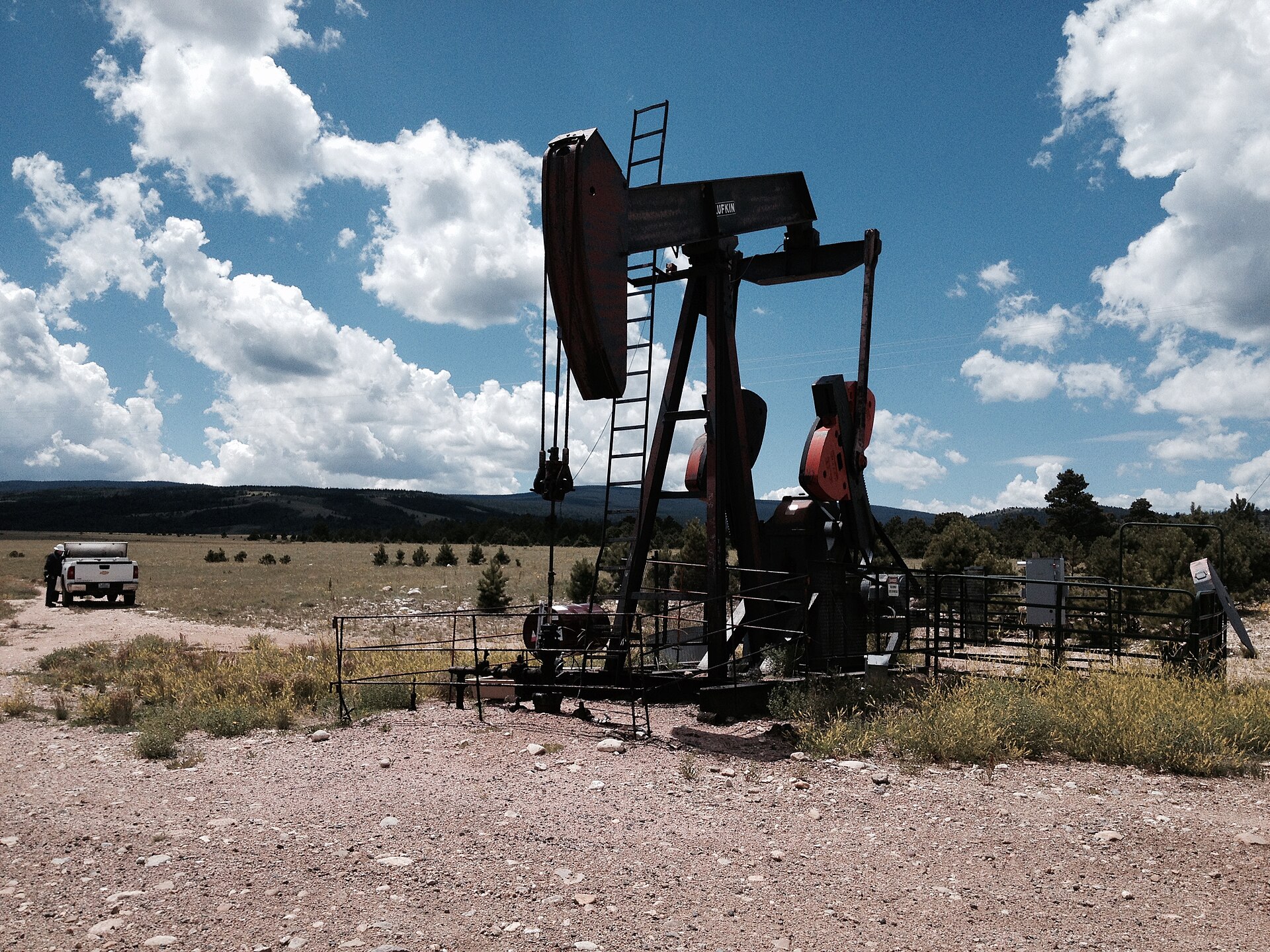 Oil pump jack operating in a remote field, representing OPEC crude oil production capacity