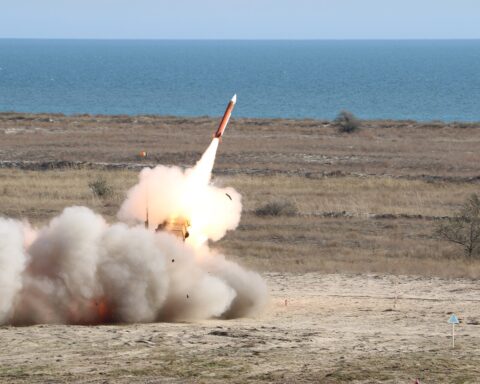PAC-3 Patriot missile launches from its battery during live-fire exercise, showing the interceptor in flight above the launcher