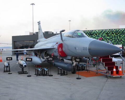 A Pakistan Air Force JF-17 Thunder Block III fighter jet on the tarmac at the Dubai Airshow 2023, serial number 308, displayed with air-to-ground munitions