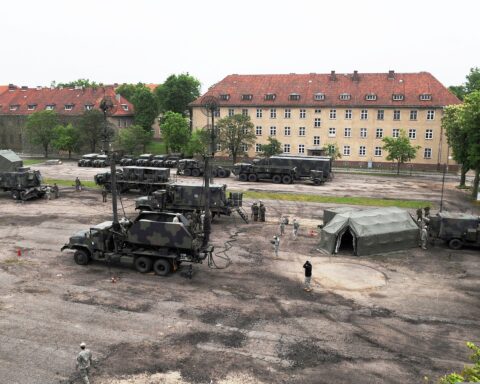 US Army Patriot missile battery deployed at military base in Poland, 2010, showing launchers, radar and command vehicles