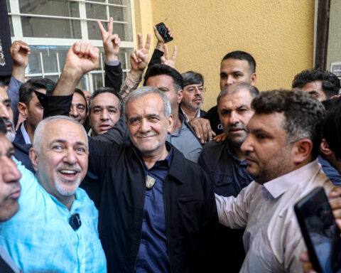 Iranian President Masoud Pezeshkian greeted by supporters after voting in the 2024 presidential election — the civilian leader who publicly named IRGC commanders Vahidi and Abdollahi as responsible for destroying ceasefire talks