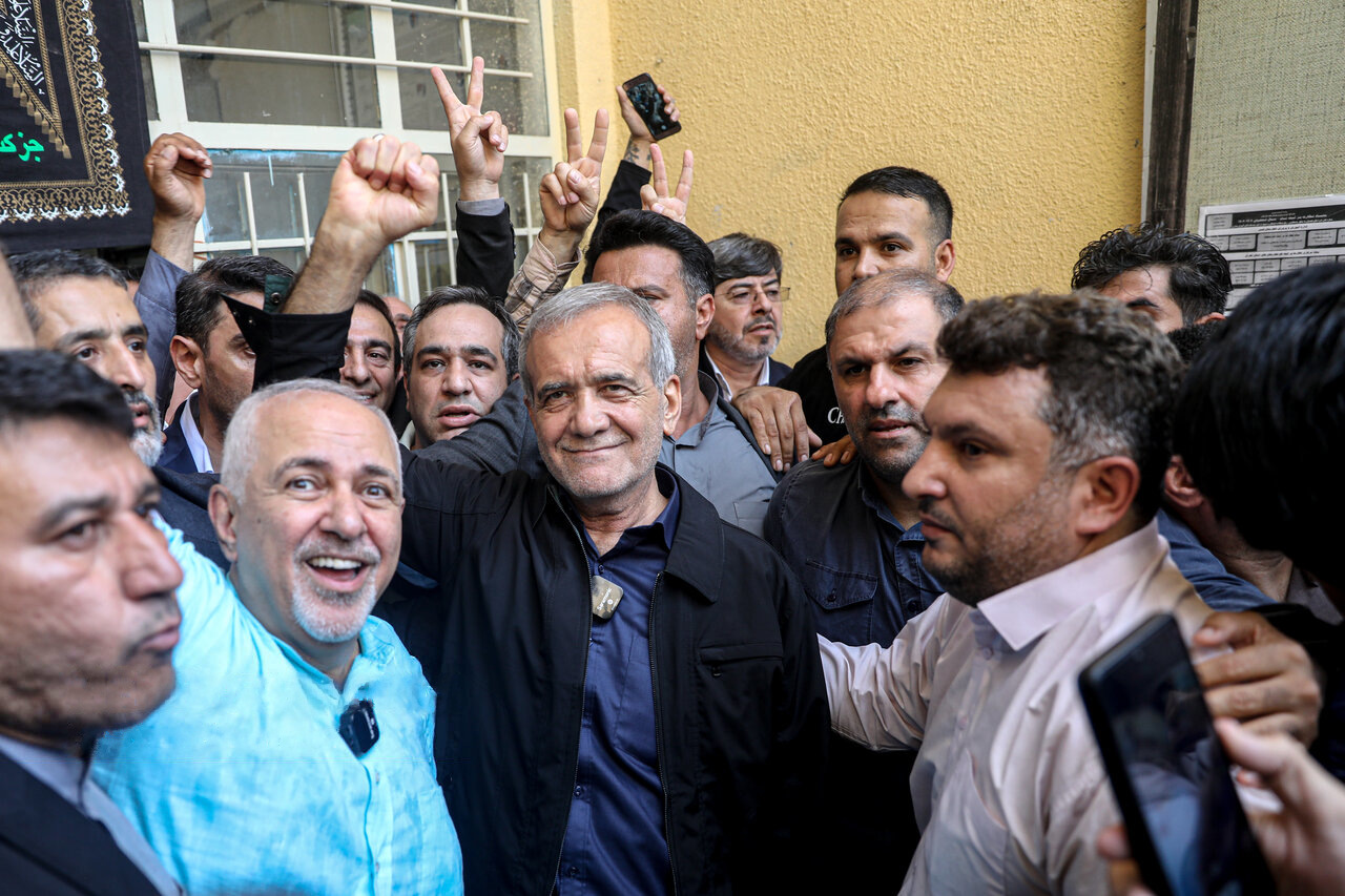 Iranian President Masoud Pezeshkian greeted by supporters after voting in the 2024 presidential election — the civilian leader who publicly named IRGC commanders Vahidi and Abdollahi as responsible for destroying ceasefire talks