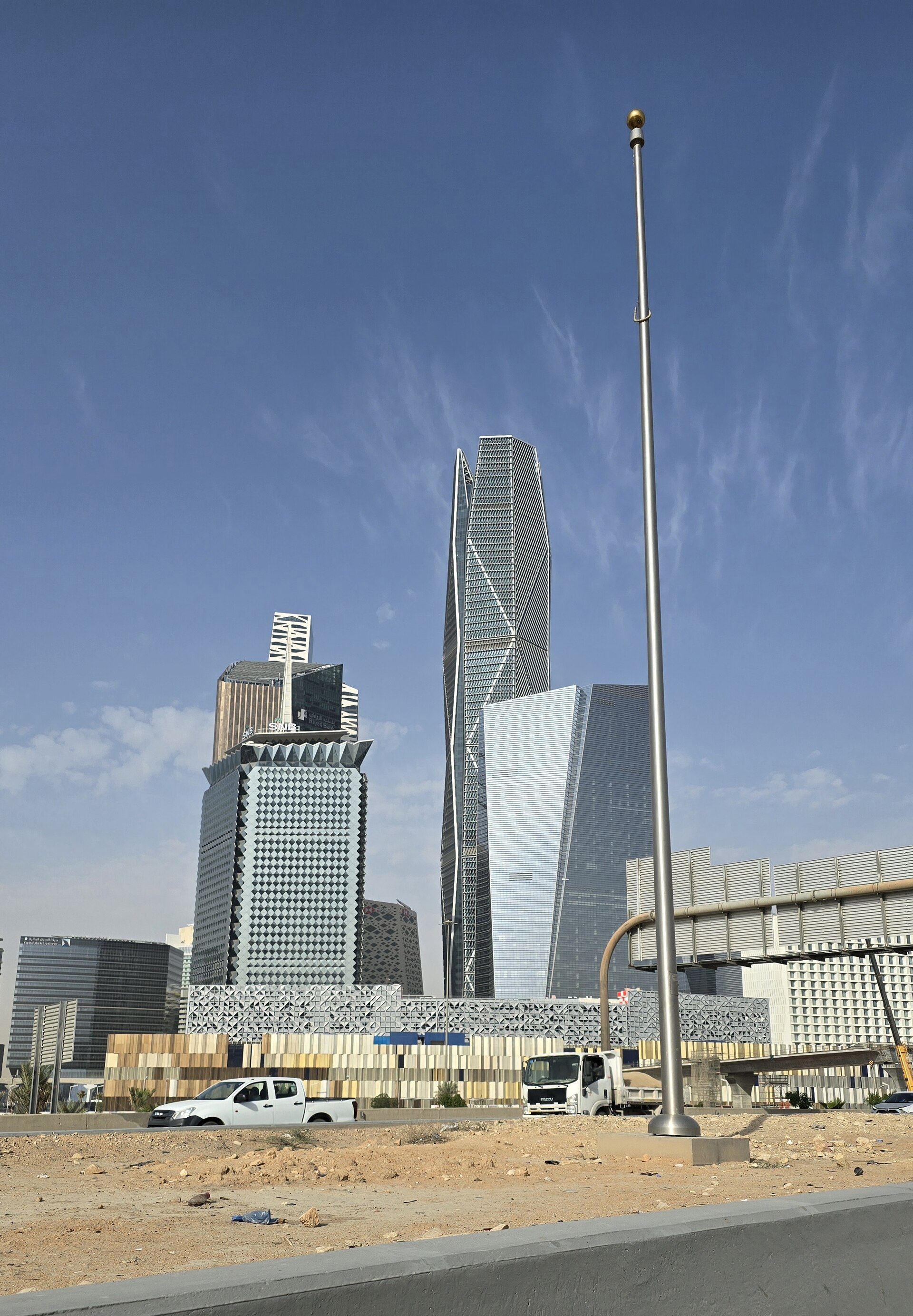 Public Investment Fund Tower in Riyadh, January 2026 — the headquarters of Saudi Arabia PIF, whose domestic construction spending was already cut 58 percent before the Hormuz crisis converted a bounded fiscal shock into an open-ended emergency