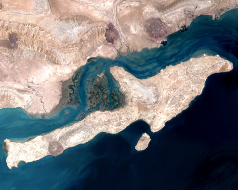 NASA Landsat 7 satellite view of Qeshm Island in the Strait of Hormuz, Iran — the waterway through which approximately 20 percent of global oil supply transits