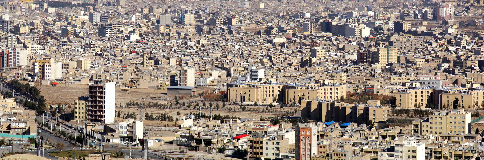 Aerial panorama of Qom city Iran — the Islamic Republic holy city where Supreme Leader Mojtaba Khamenei is reportedly incapacitated and under IRGC security cordon