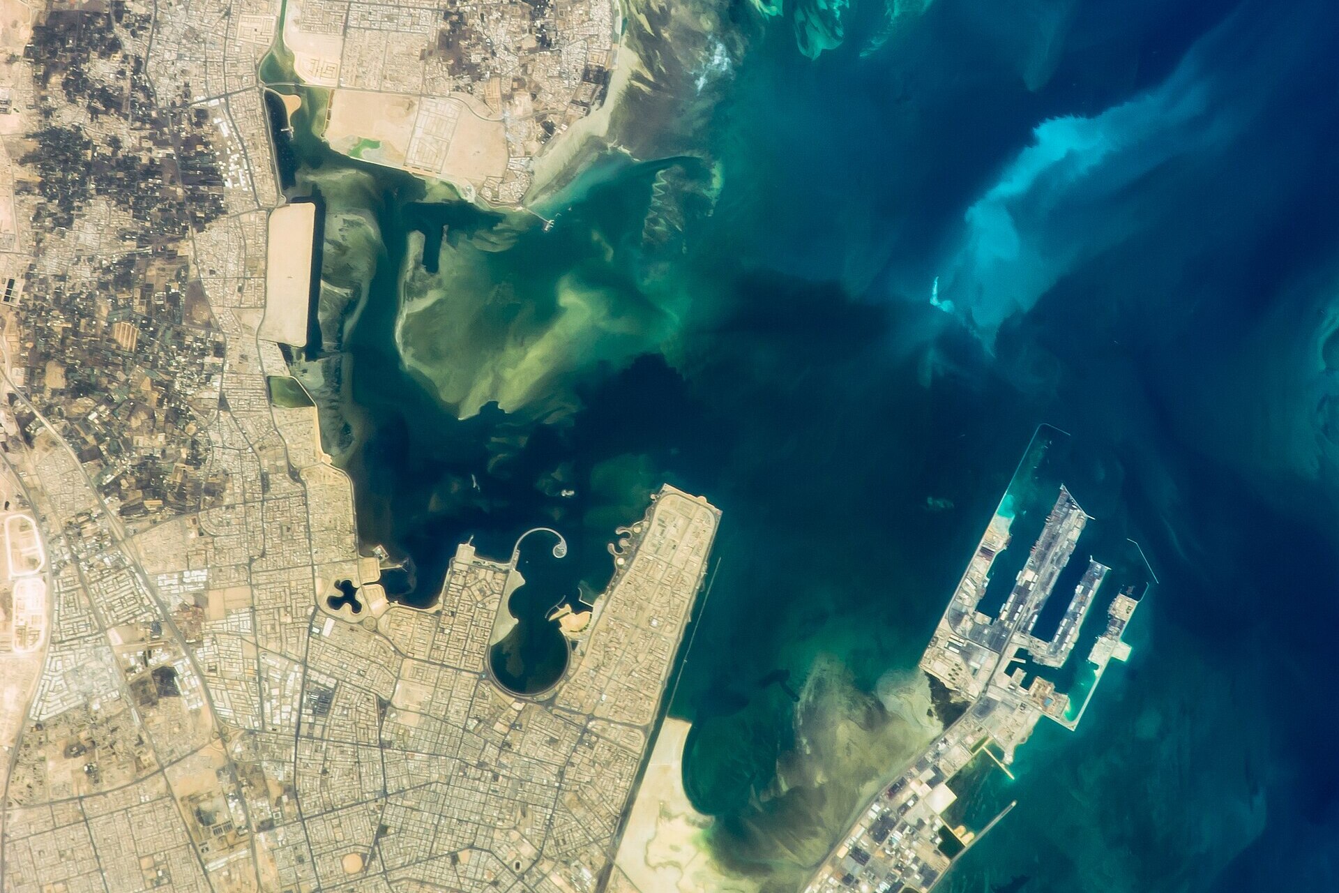 Ras Tanura oil loading terminal and offshore sea-island facilities, Saudi Arabia, photographed from the International Space Station. Aramco's Eastern Province terminals handled 80 percent of Saudi crude exports before the Hormuz blockade.