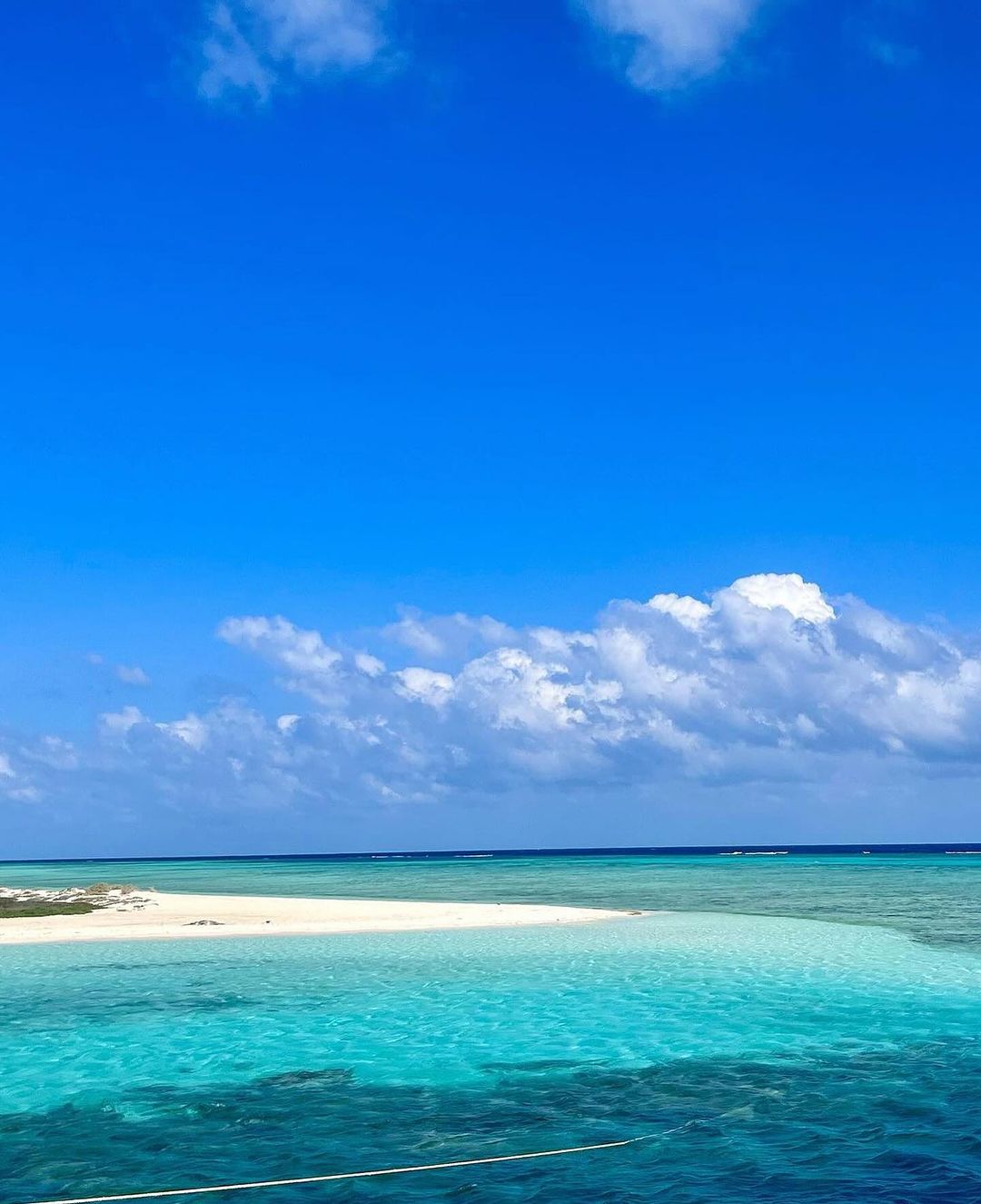 Turquoise waters and white sand at the Ummahat Islands in the Saudi Arabian Red Sea