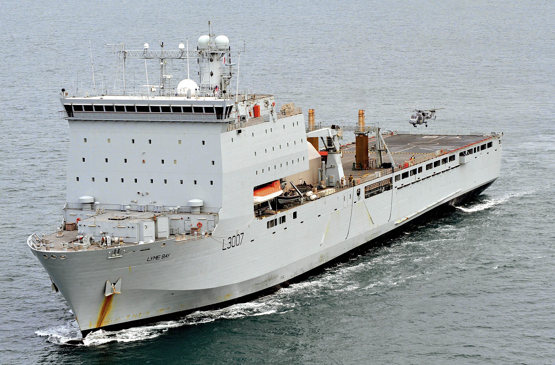 RFA Lyme Bay L3007, a Bay-class landing ship dock of the Royal Fleet Auxiliary, with a Lynx Wildcat helicopter on the flight deck