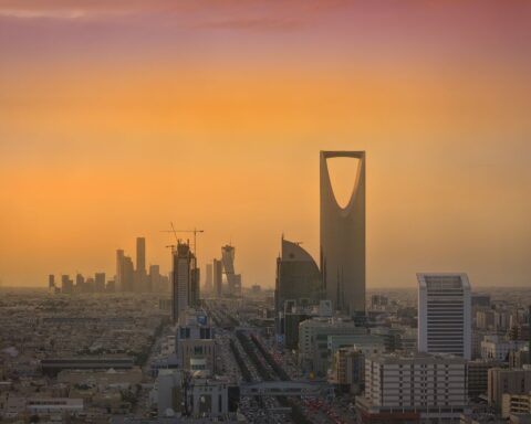 Riyadh skyline at sunset showing Kingdom Centre Tower and KAFD development, Saudi Arabia luxury hospitality district