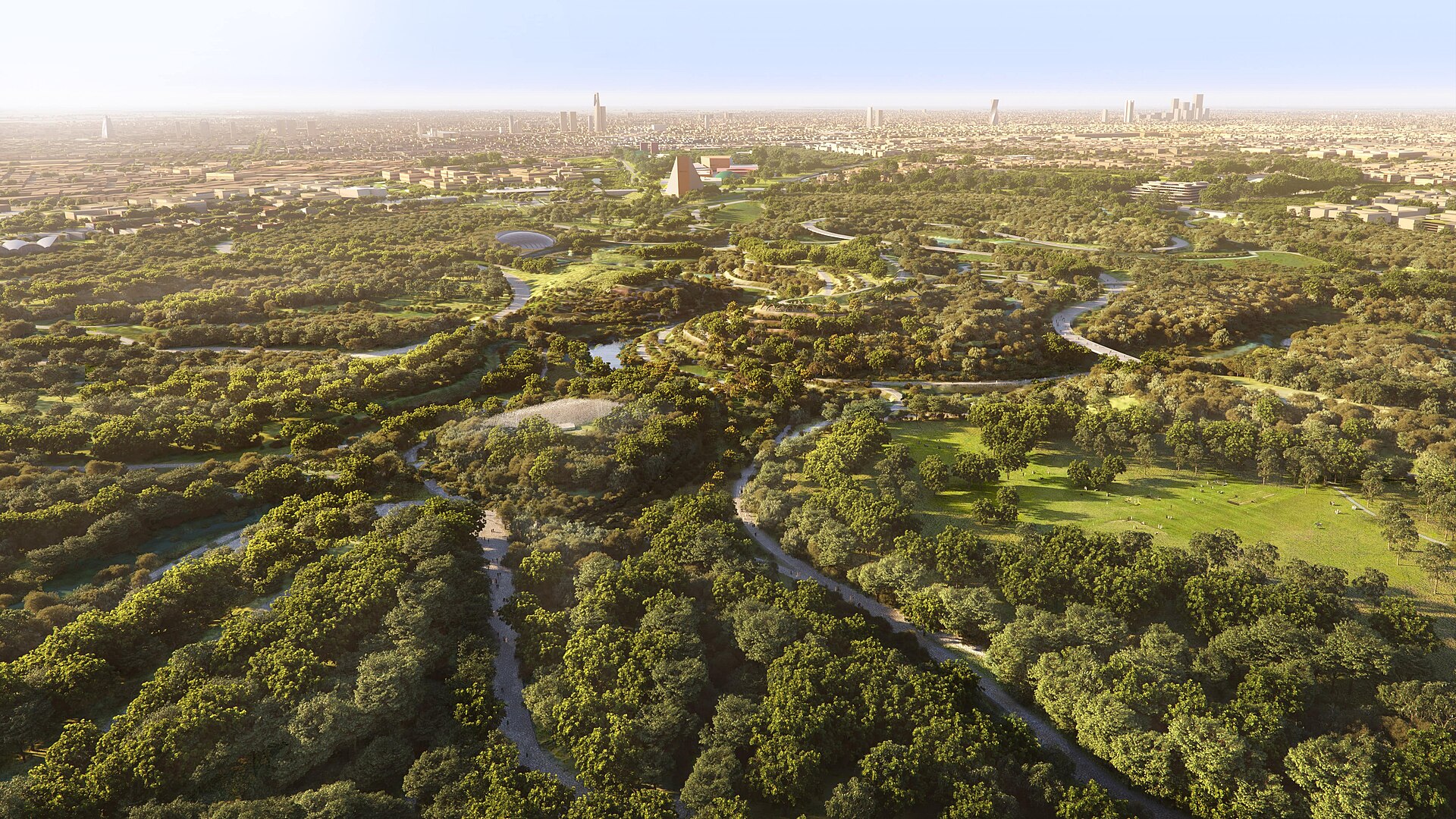 Aerial rendering of King Salman Park showing vast green landscapes, winding pathways, lakes, and Riyadh skyline in the background