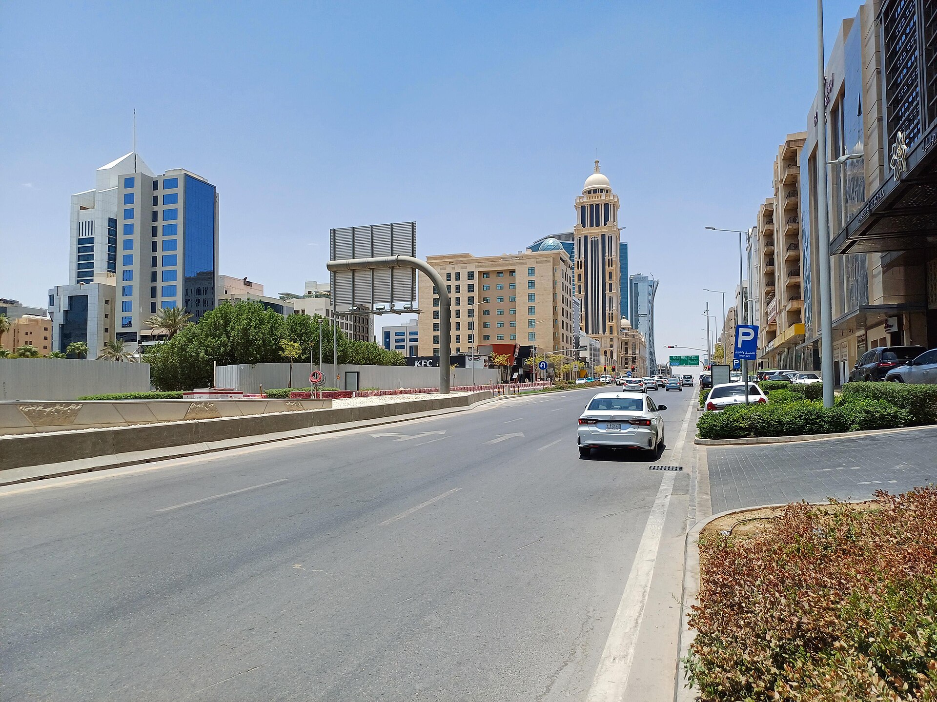 Olaya Street in central Riyadh showing commercial towers and street-level retail