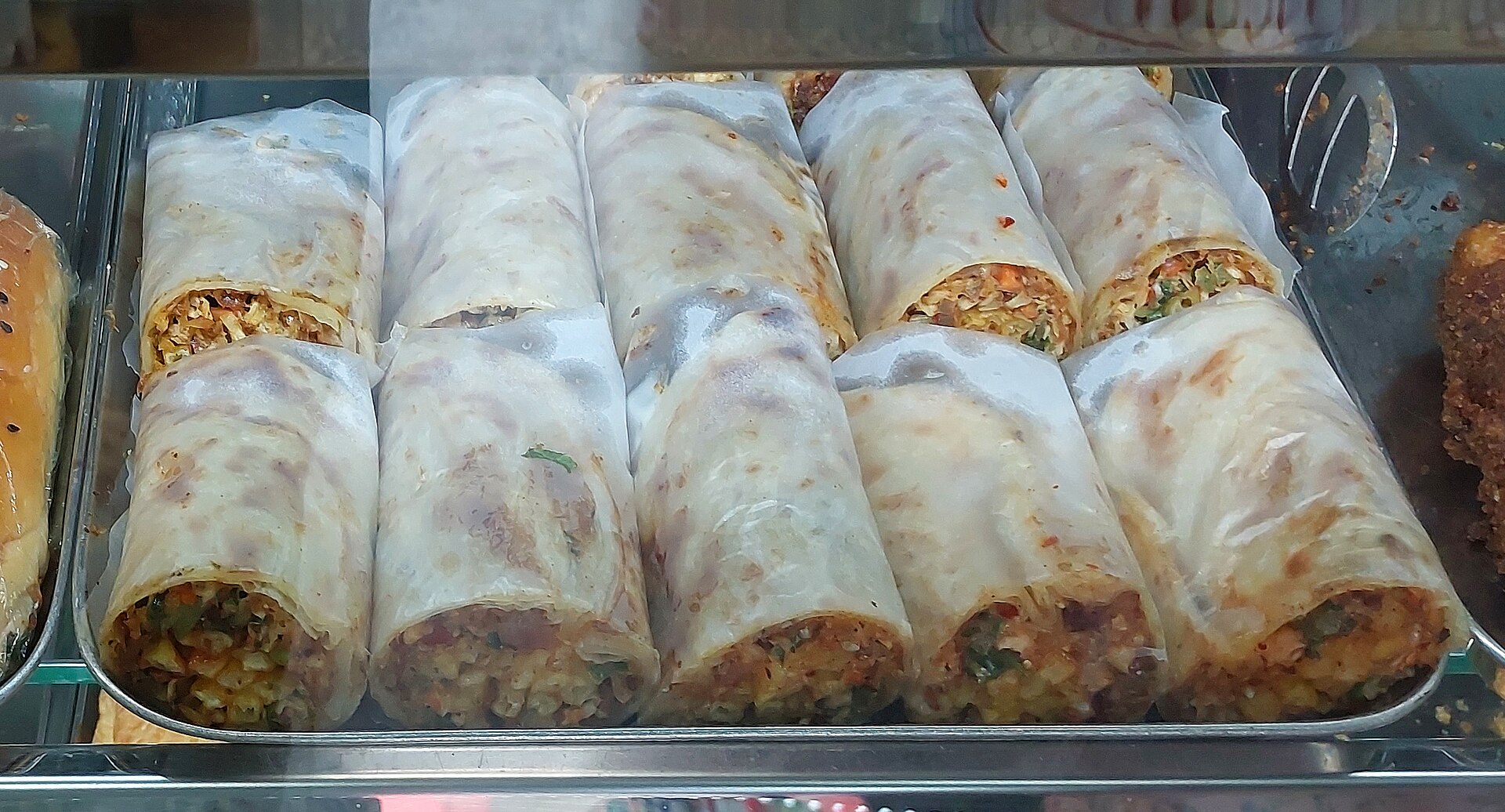 Shawarma rolls cut and served as snacks, a popular quick-bite format in Saudi Arabia