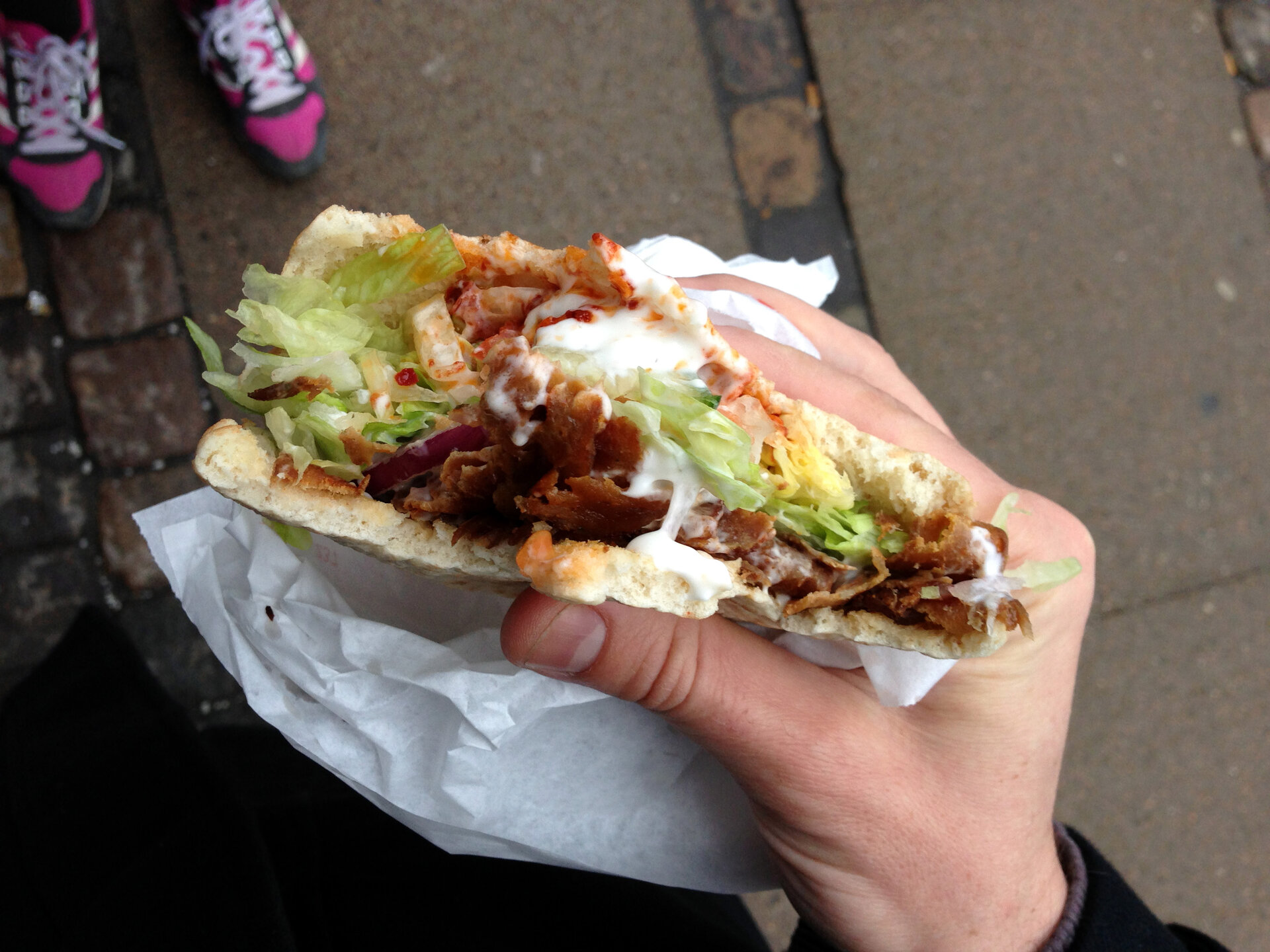 Freshly wrapped shawarma sandwich ready to eat, a staple street food found on every corner in Riyadh