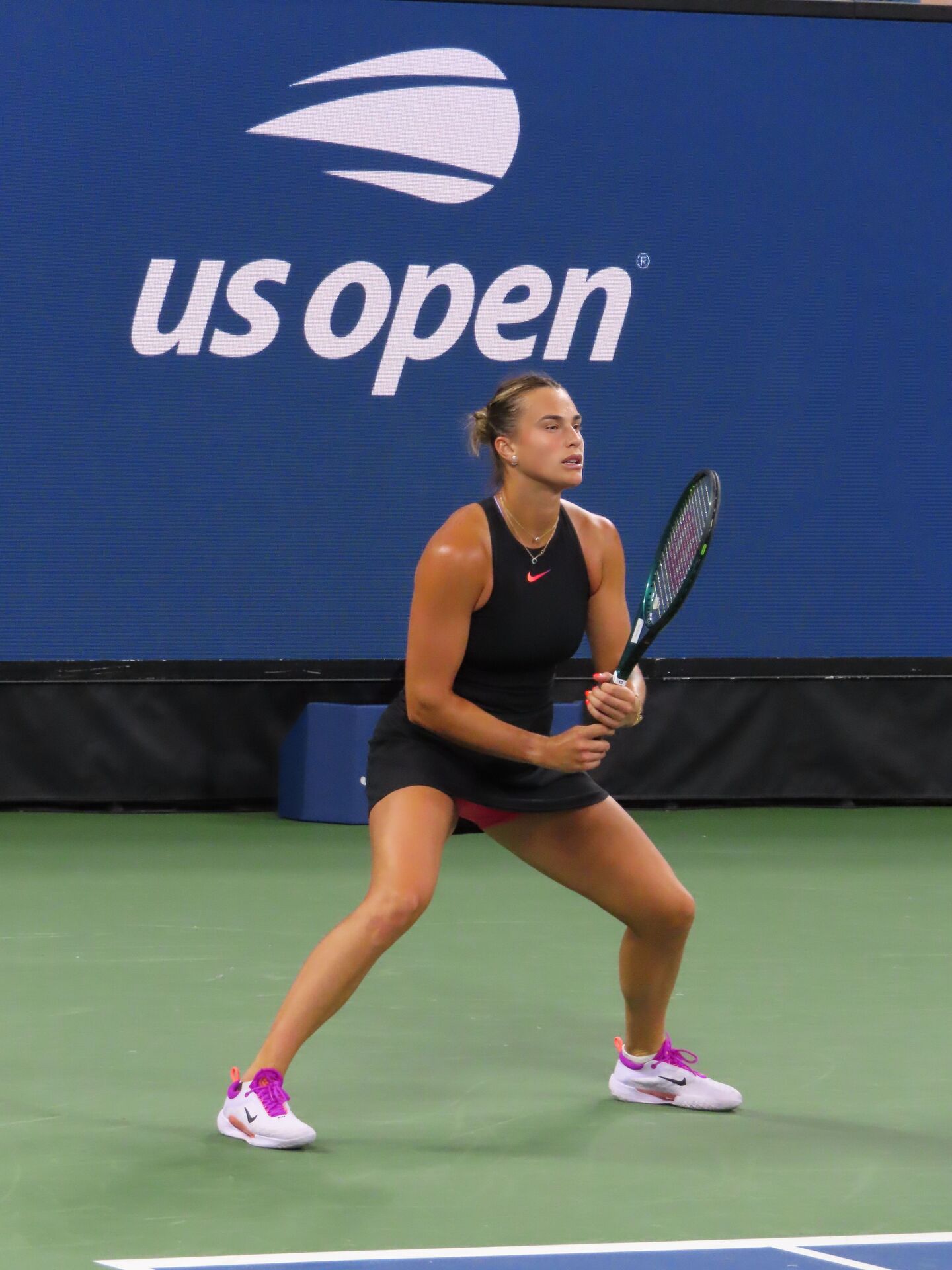 Aryna Sabalenka in a ready position during a professional tennis match, the Belarusian was runner-up at the 2025 WTA Finals in Riyadh