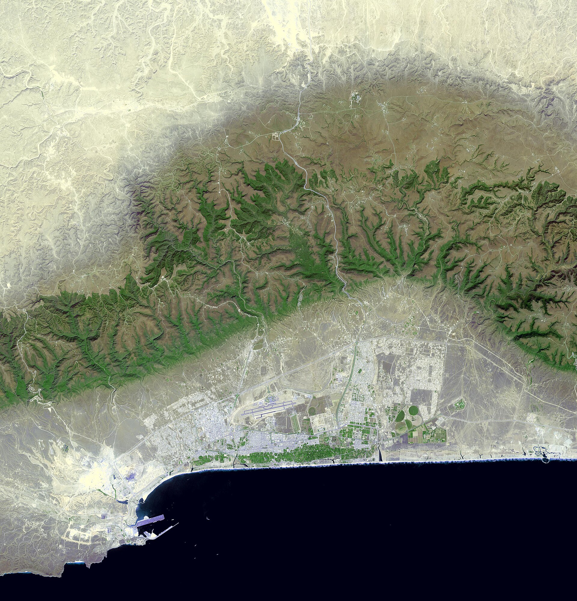 NASA ASTER satellite view of Salalah, Oman, showing the port facility and Arabian Sea coastline