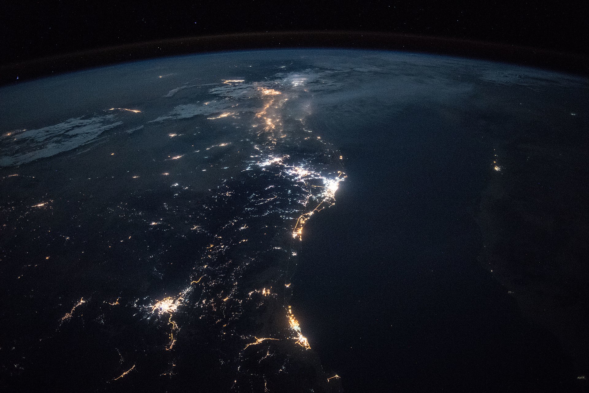 NASA ISS Expedition 55 night photograph of Saudi Arabia s western Red Sea coastline, showing city lights from Jeddah, Yanbu, and Medina. Yanbu — the terminus of the East-West Pipeline — is visible in the central cluster