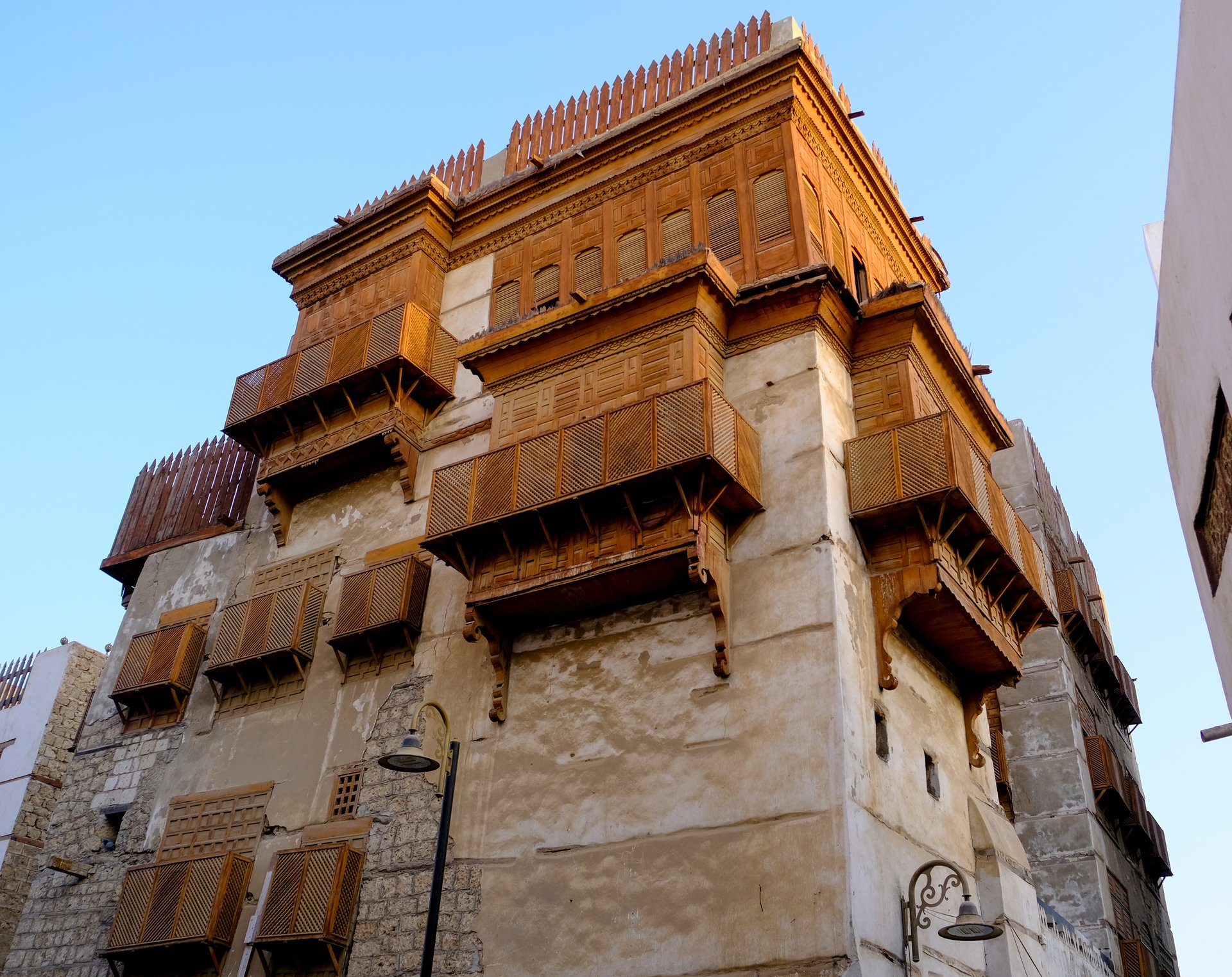Traditional coral-stone building with wooden rawasheen balconies in Al Balad old town Jeddah