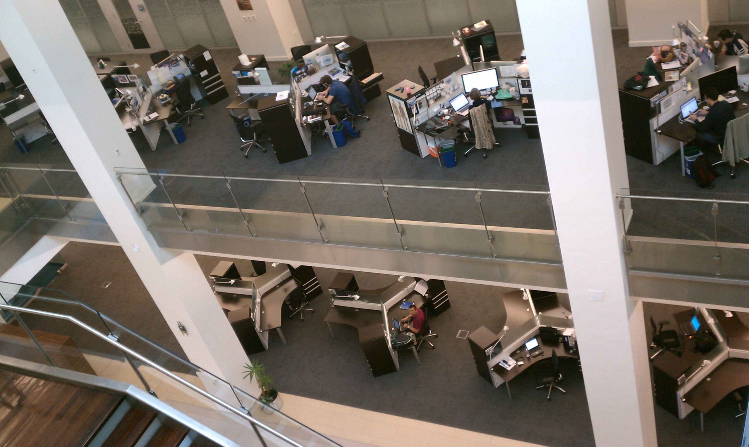 Modern open-plan office workspace in Saudi Arabia with workstations and natural light