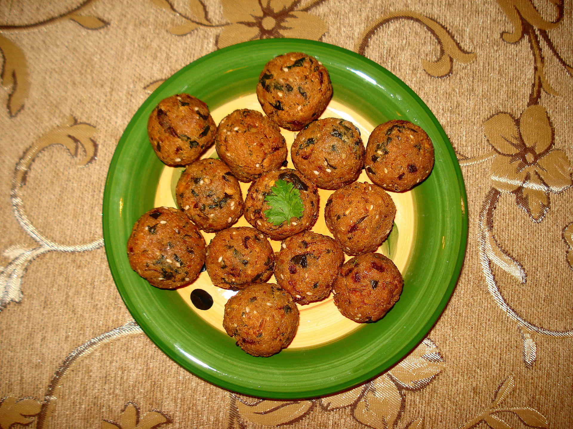 A plate of freshly made falafel balls, a vegan street food staple across Saudi Arabia