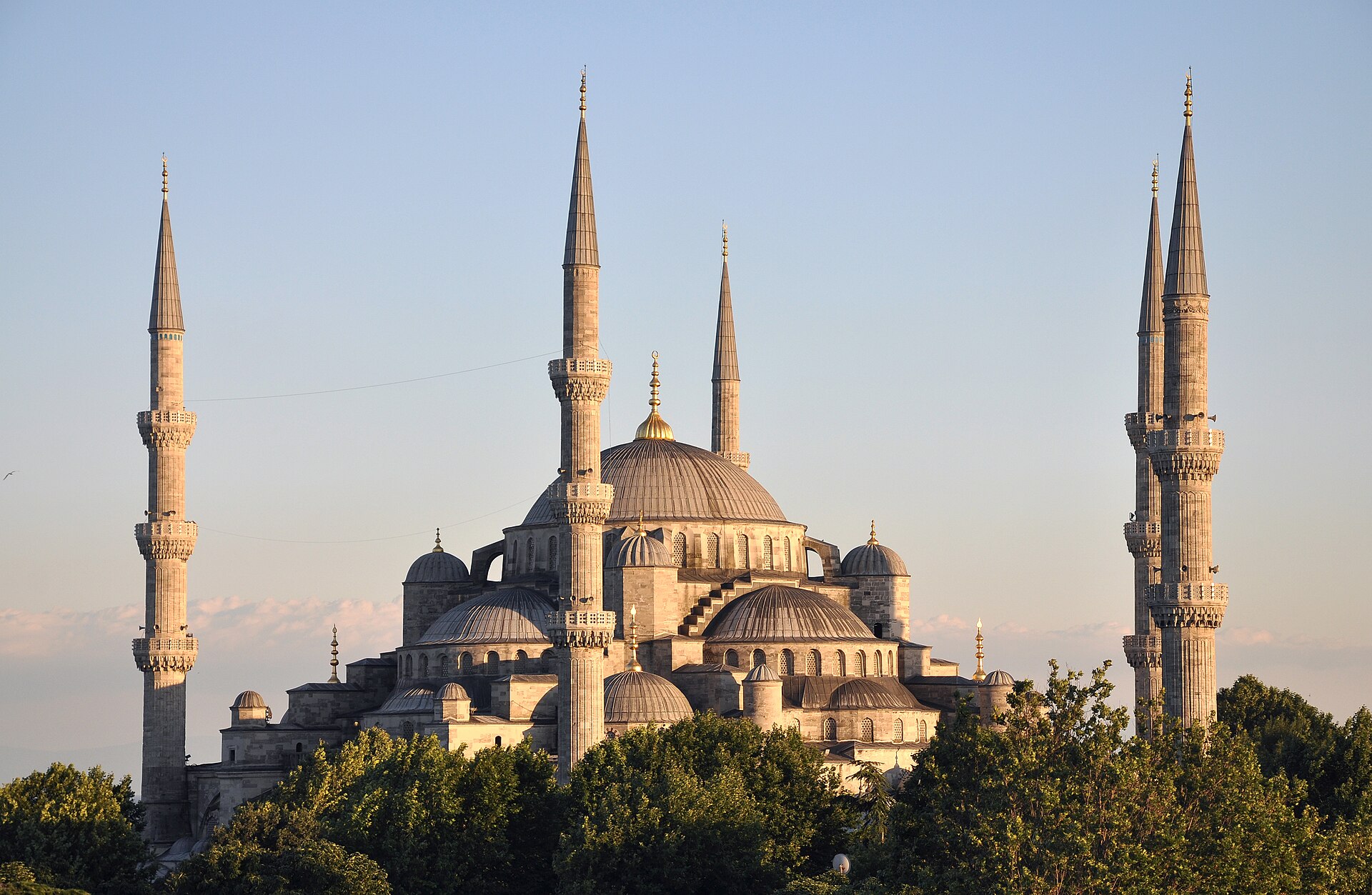 The Blue Mosque (Sultan Ahmed Mosque) in Istanbul at sunset with six minarets and cascading domes