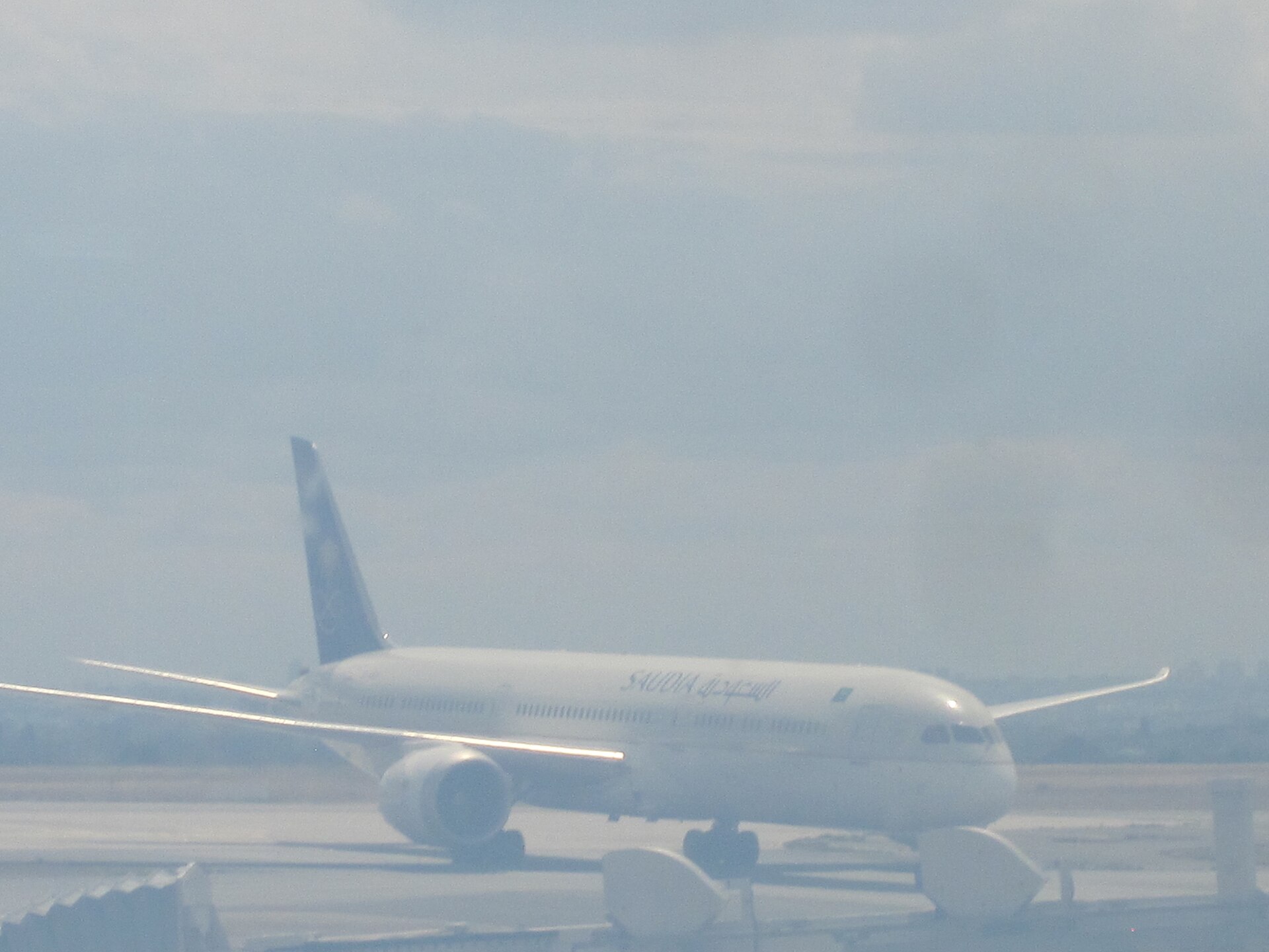 A Saudia Boeing 787 Dreamliner on the tarmac at an airport