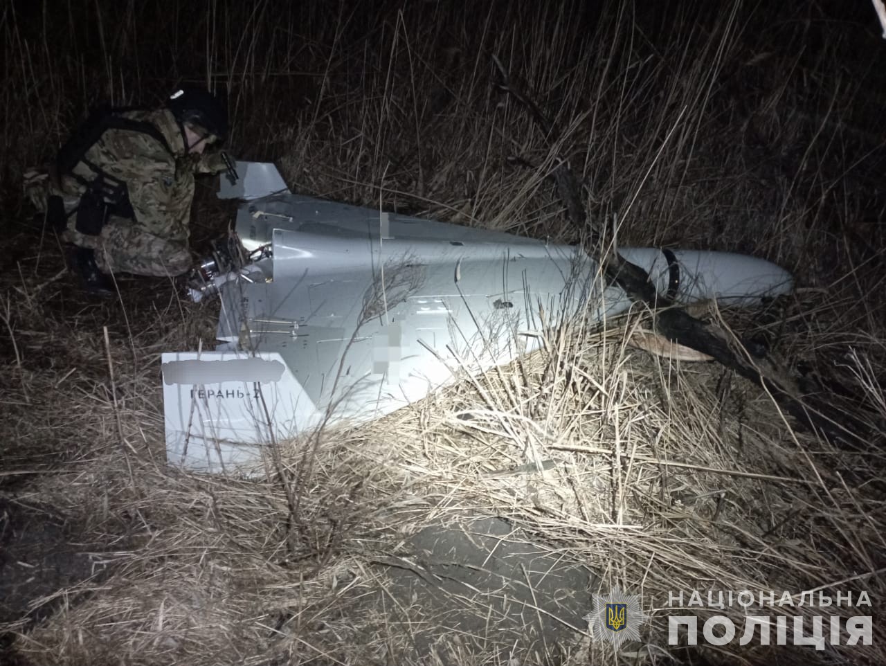 A Ukrainian soldier examines a downed Shahed-Geran drone in Kharkiv Oblast, February 2024. Ukraine has intercepted thousands of Shahed variants since Russia first deployed them in September 2022, building the data library now being exported to Gulf states.
