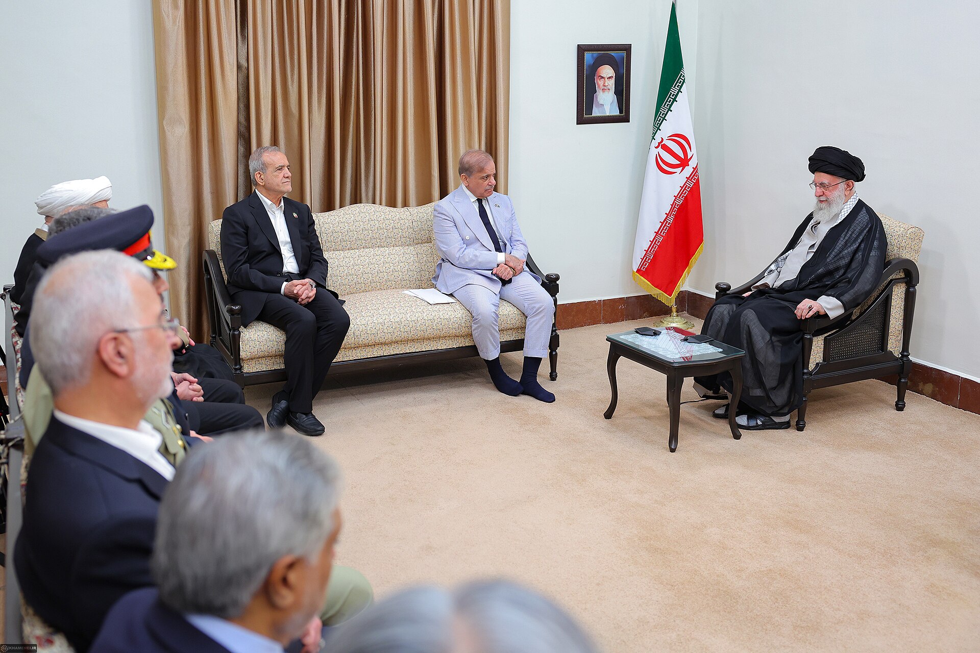 Pakistan Prime Minister Shehbaz Sharif meets Supreme Leader Ayatollah Khamenei in Tehran — illustrating Pakistan's structural role as both Iran's protecting power and Saudi Arabia's SMDA treaty ally