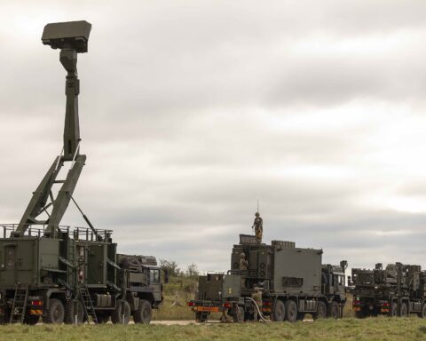 Royal Artillery Sky Sabre air defence system showing Saab Giraffe AMB radar on extended mast alongside CAMM launcher vehicles in operational deployment configuration