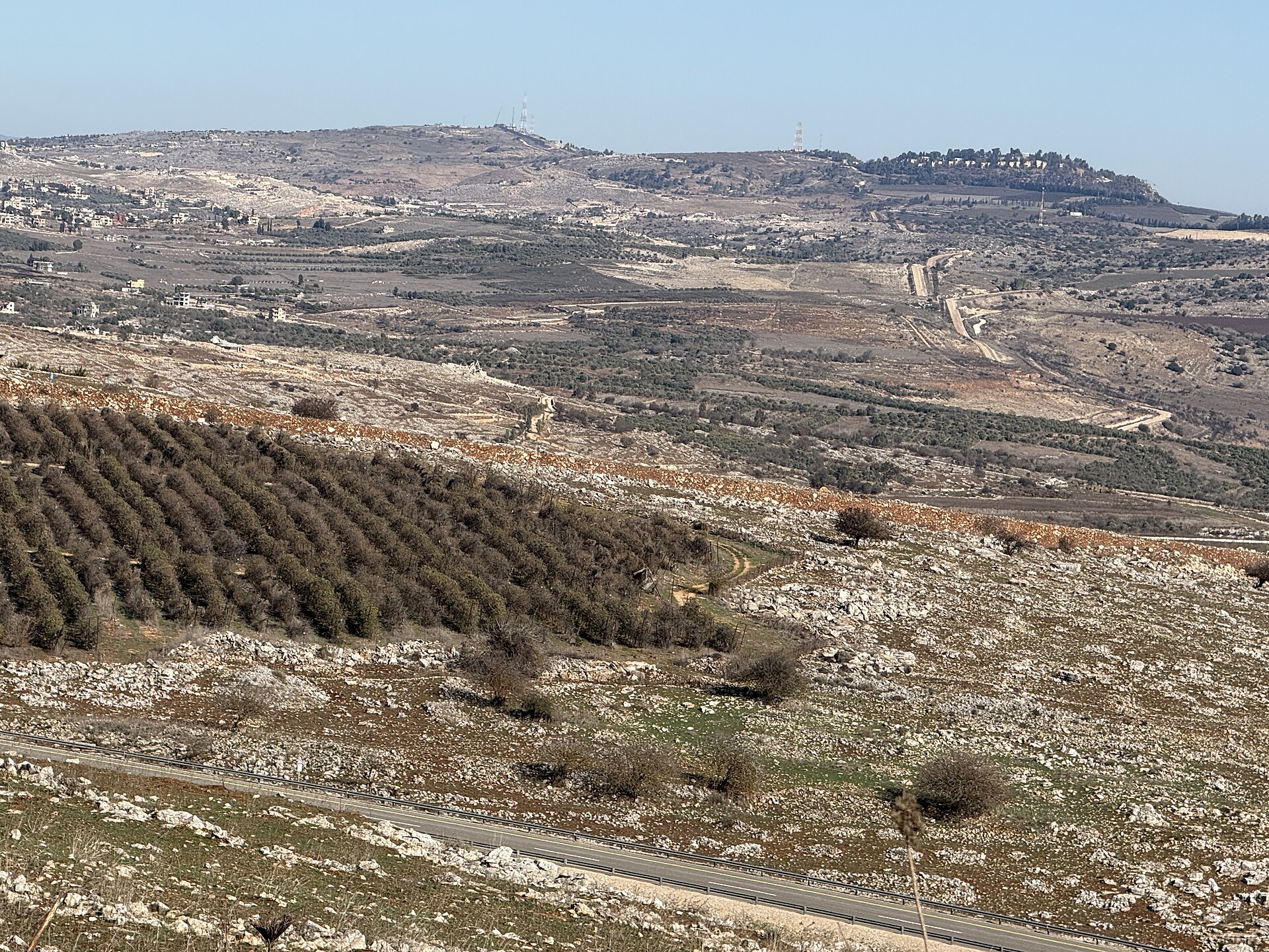 The village of Yarin in southern Lebanon, looking north toward hilltop settlements and terraced olive groves along the Lebanon-Israel border zone — the terrain where the April 16 ceasefire was violated within hours of taking effect