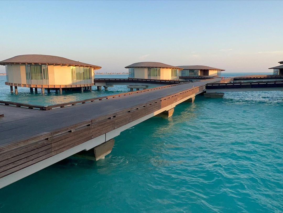 Boardwalk connecting overwater villas at The St. Regis Red Sea Resort in Saudi Arabia