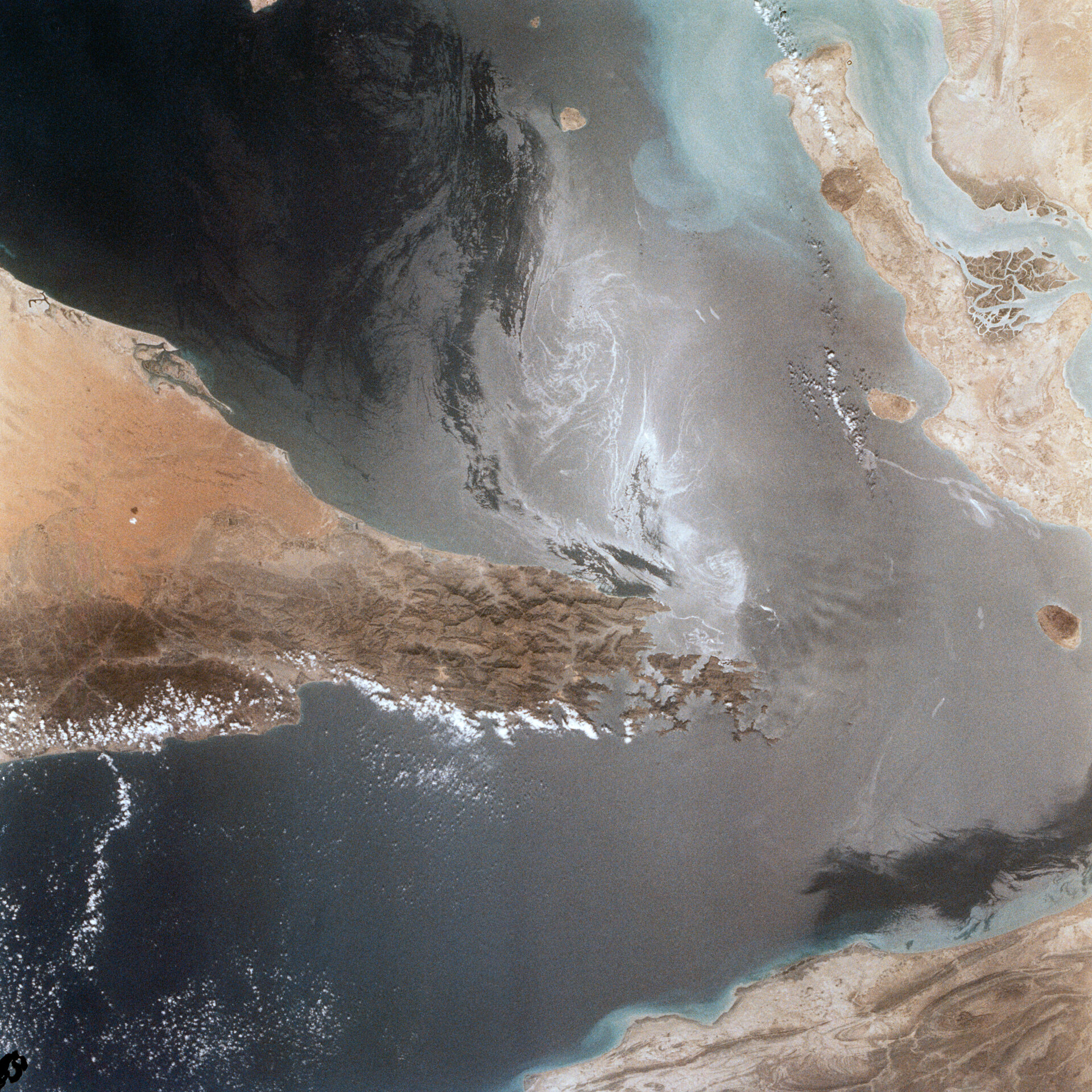Strait of Hormuz from space — NASA space shuttle photograph showing the 21-mile-wide chokepoint through which 20 percent of global oil supply passes
