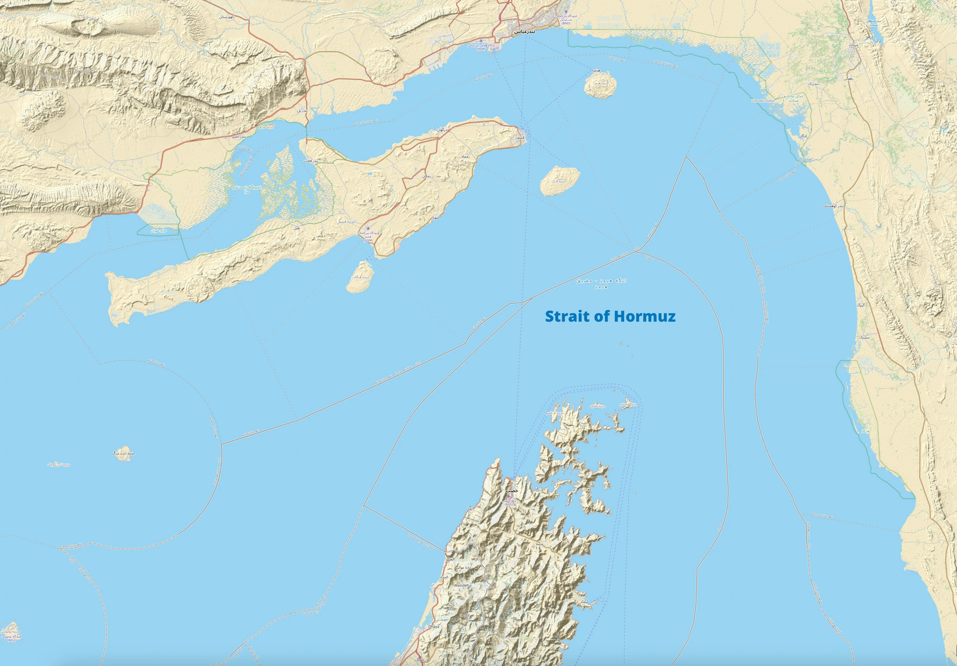 OpenStreetMap rendering of the Strait of Hormuz showing the narrow navigable corridor between Iran and Oman through which roughly 20 percent of global oil supply transits