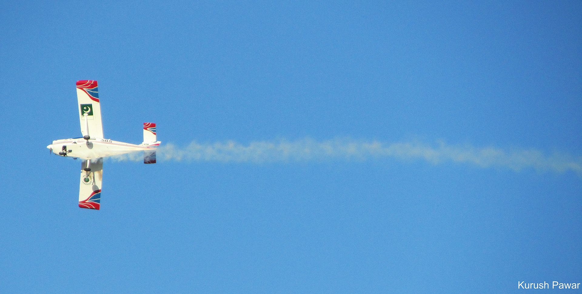 PAC MFI-17 Super Mushshak trainer aircraft of the Pakistan Air Force in flight, showing Pakistani national markings