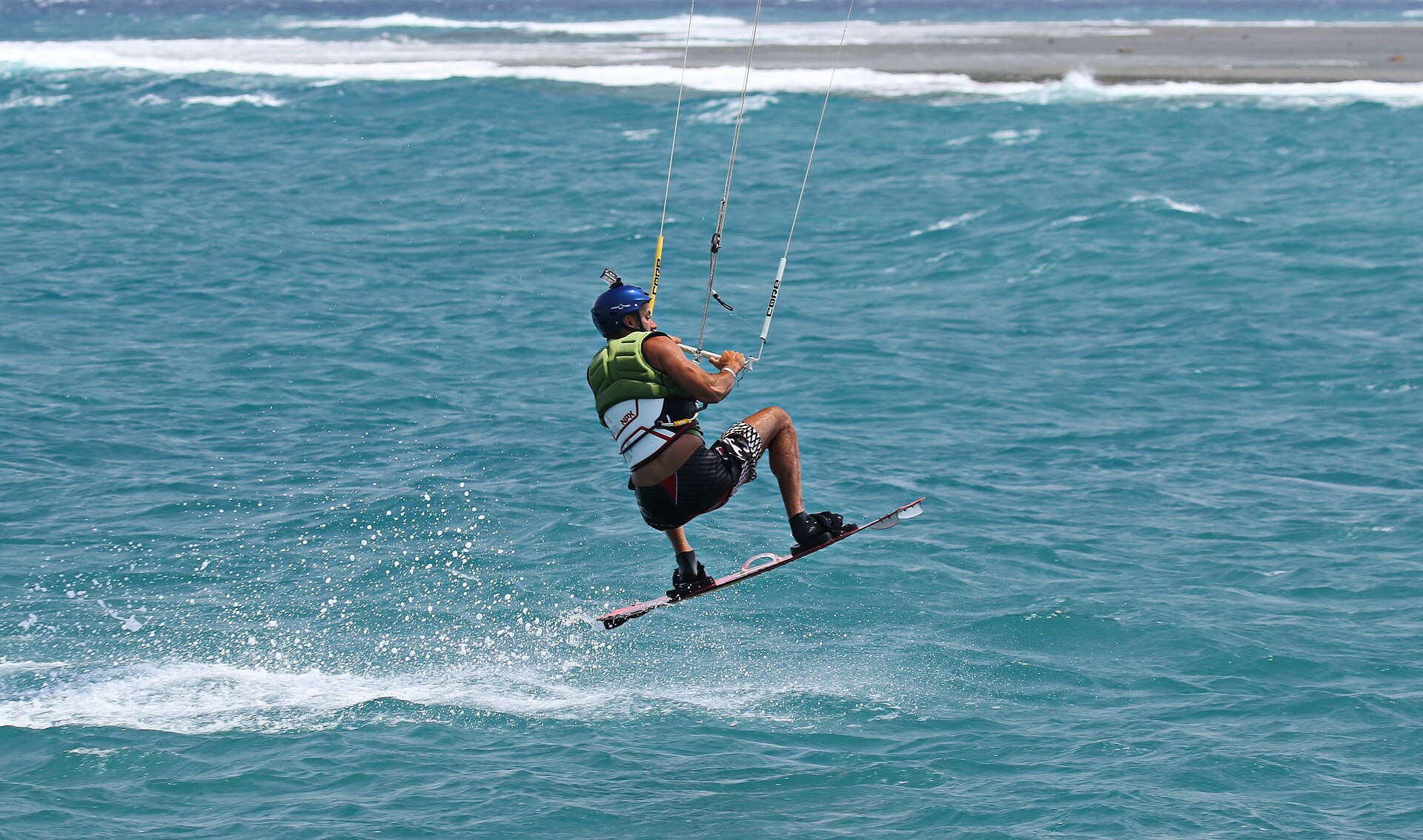 Surfer riding a wave on the Red Sea