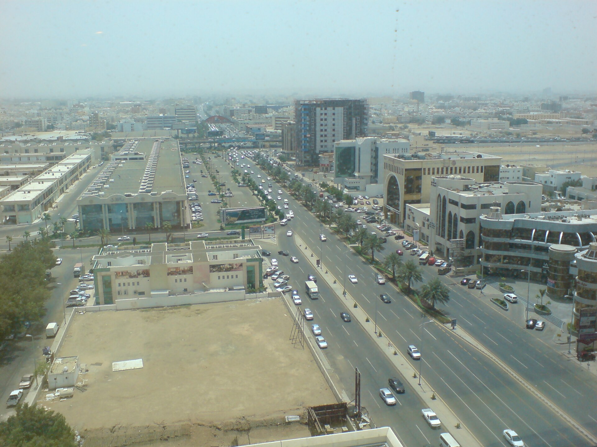 Aerial view of Tahlia Street in Jeddah showing the wide boulevard lined with commercial buildings