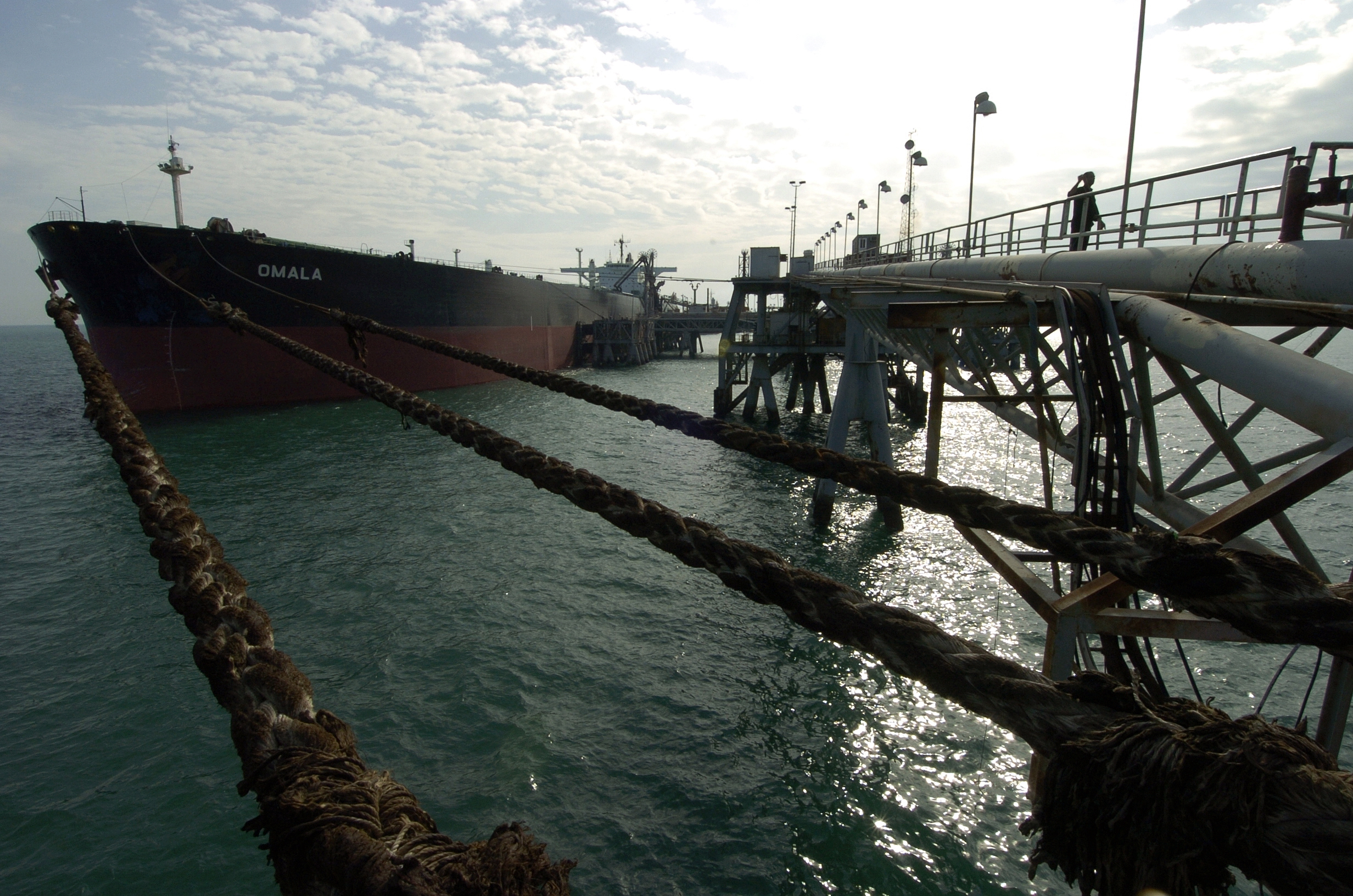 Oil tanker Omala moored at crude loading terminal in the Persian Gulf, receiving payload from offshore oil export infrastructure