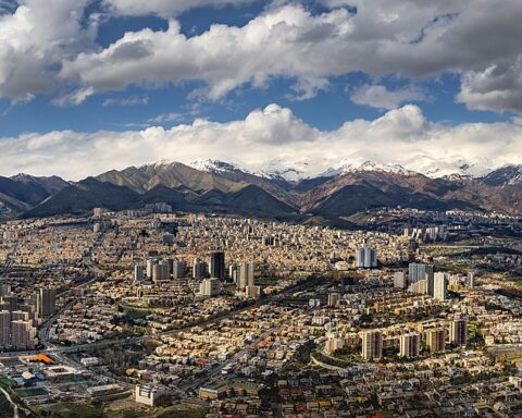 Tehran northern panorama viewed from Milad Tower, with the snow-capped Alborz mountains behind the city skyline