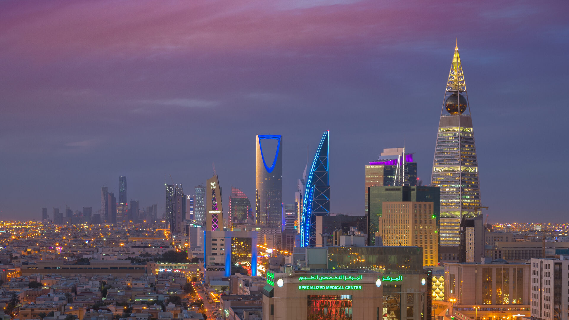 The Riyadh skyline at night featuring Kingdom Tower and Al Faisaliah Tower