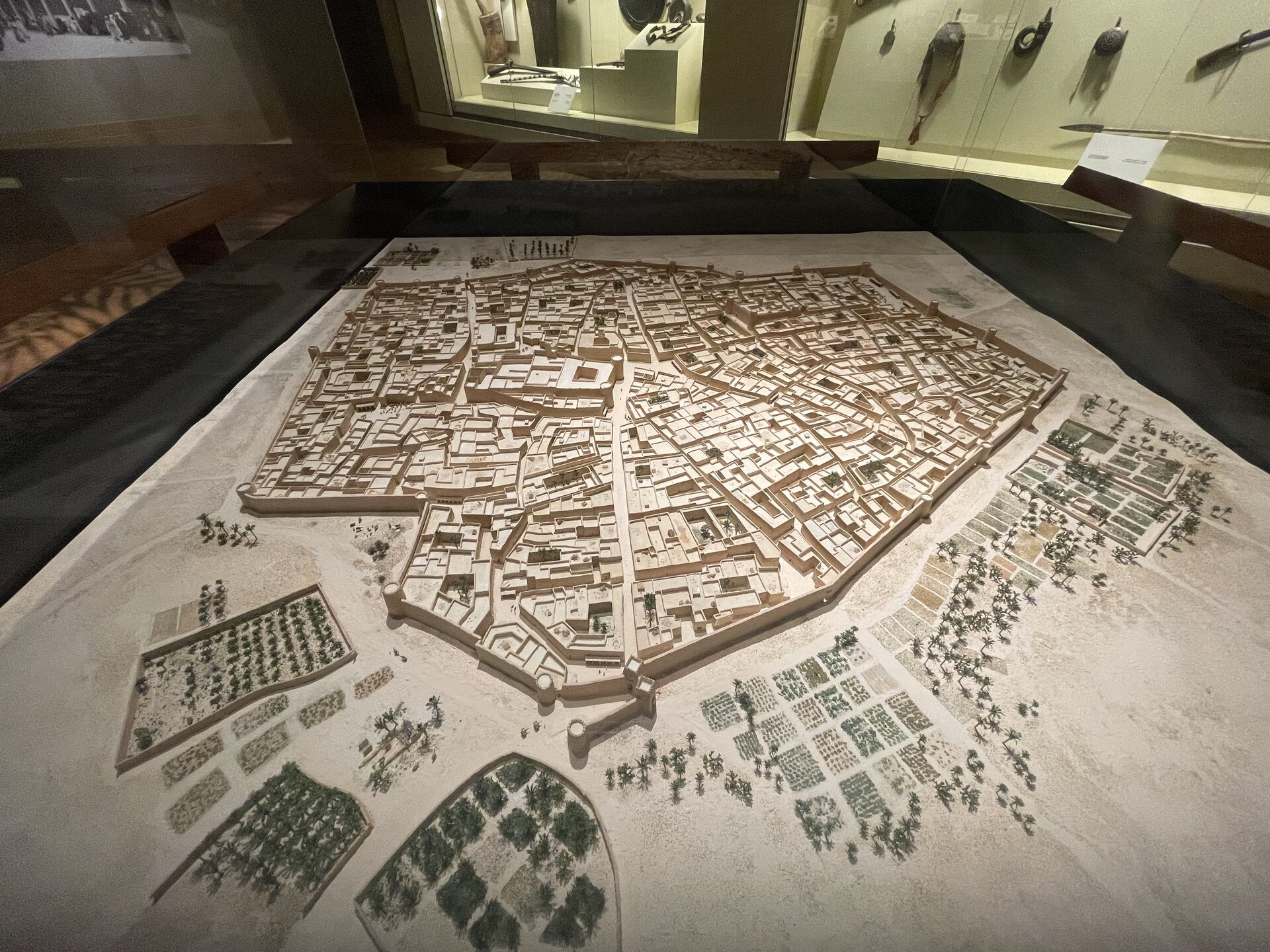 Detailed scale model of the historic city of Diriyah viewed through a glass floor at the National Museum of Saudi Arabia