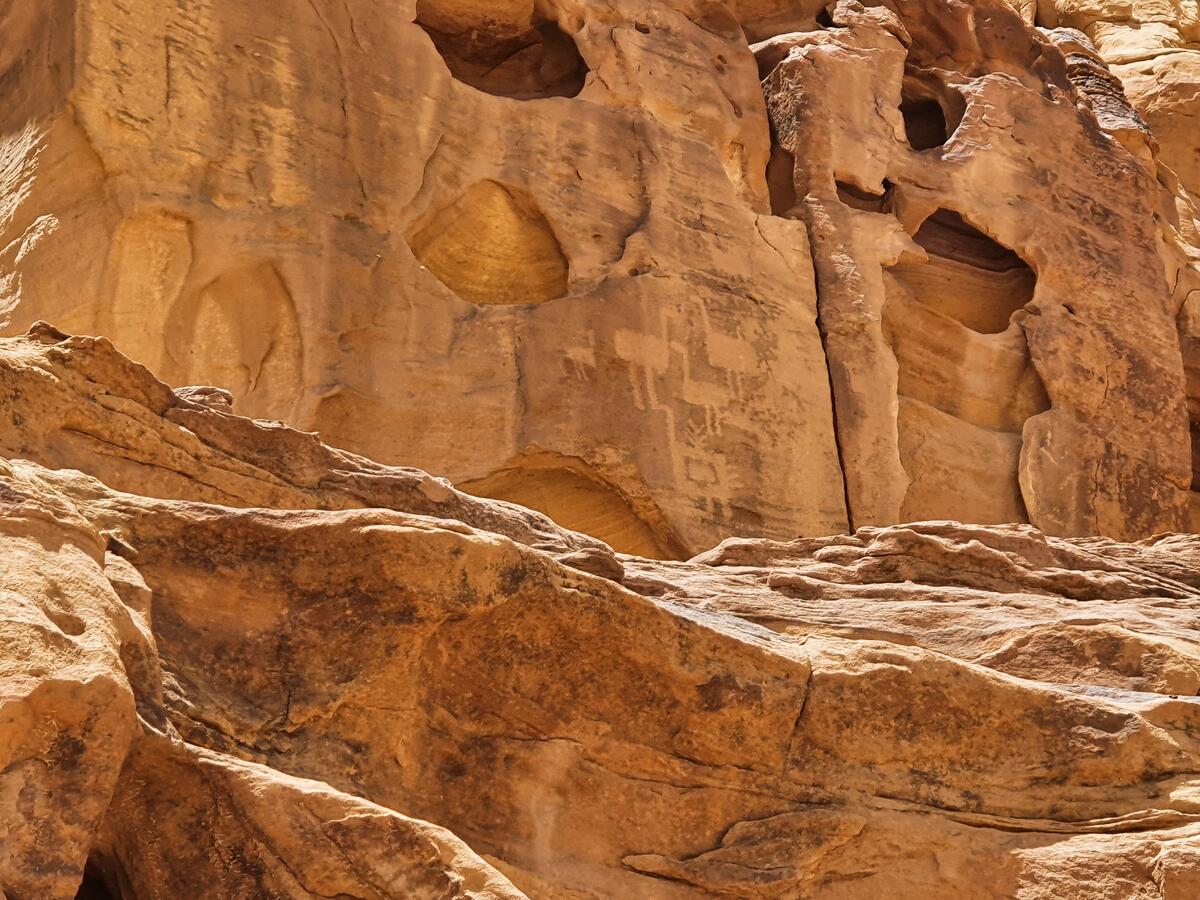 Ancient petroglyph carvings in eroded sandstone at AlUla in western Saudi Arabia